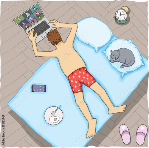 Man in red boxers working from bed with a laptop and cat.