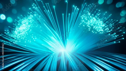 Brilliant blue fiber optic lights bursting from a central point, creating a dynamic, futuristic atmosphere. The radiant strands extend outward, symbolizing energy, connectivity, and modern technology.