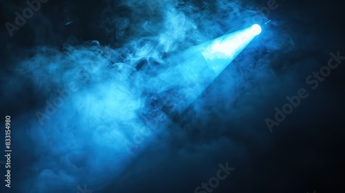 Showcase the dramatic allure of your products with an image featuring a blue vector spotlight projecting through smoke volume light effects against a dark backdrop. © Wattana