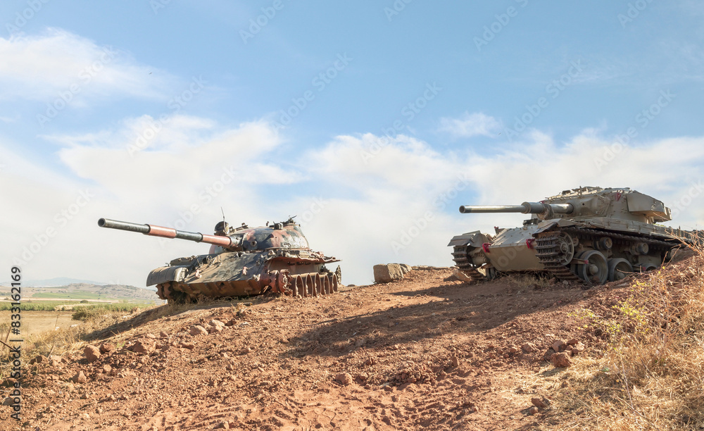 Fototapeta premium Syrian and Israeli tanks destroyed during the Yom Kippur War are in the Valley of Tears at the OZ 77 Tank Brigade Memorial on the Golan Heights in northern Israel