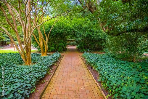 A 14 acre public garden wrapped behind a serpentine brick wall i photo