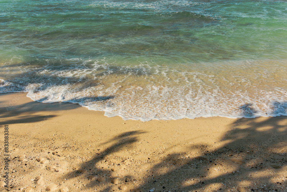 Tropical blue ocean water washes on beach shore line sands Tropical blue ocean water washes on beach shore line sands