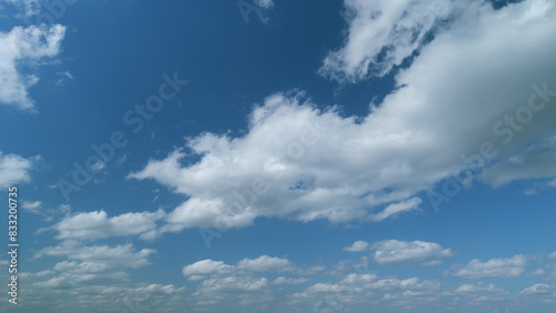 Beautiful cumulus and stratocumulus clouds. Daytime sky with cumulus clouds. cumulus clouds in a blue sky. Timelapse.