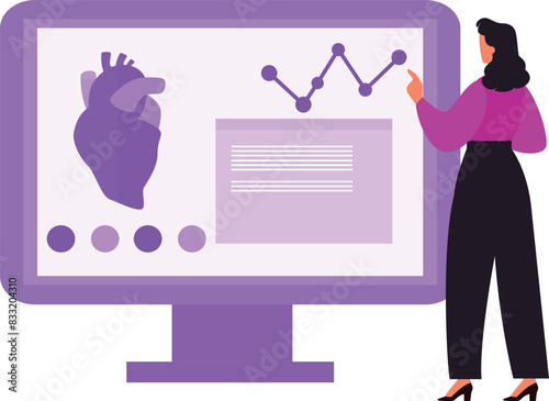 The girl is pointing at the heart on the monitor.
