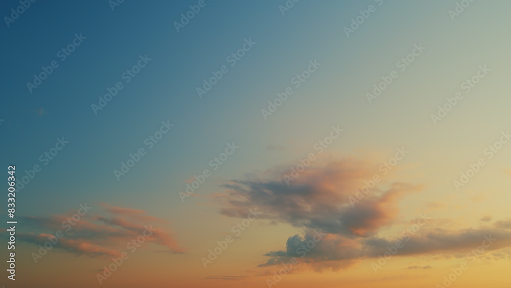 Sunrise Sundown Natural Background. Extra Large Panoramic View. Pink Clouds Lit By Setting Sun Against Evening Blue Sky.