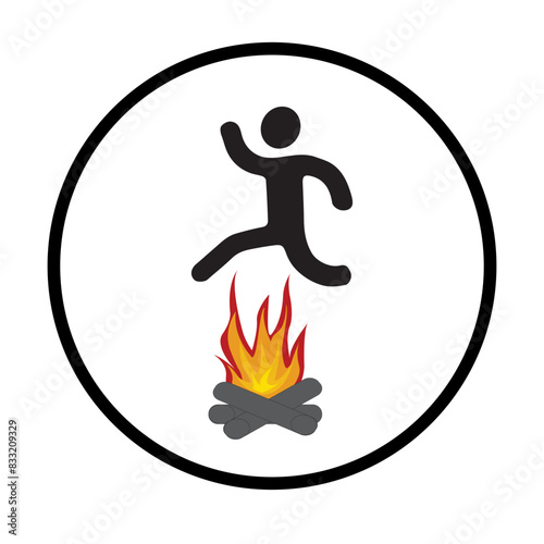 Silhouette of a person jumping over fire