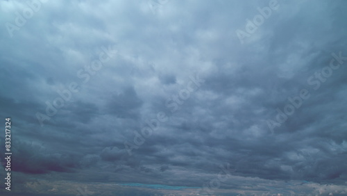 Dark Clouds Landscape. Natural Rainy Dark Sky. Cloudy Day. Puffy Forming Cloudscape. photo