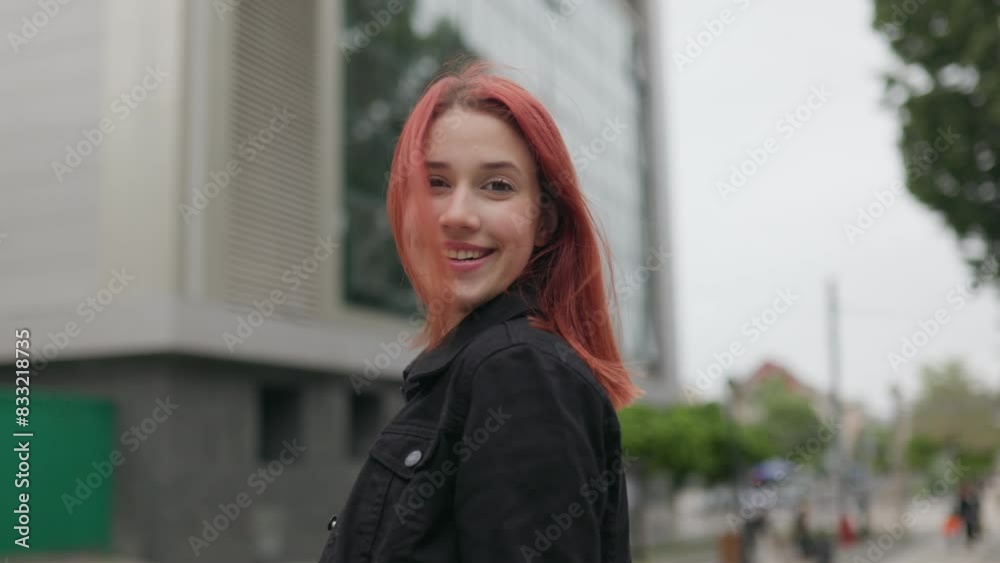 Portrait of a Smiling Teenage Girl with Red Hair in an Urban Setting Portrait of a Smiling Teenage Girl with Red Hair in an Urban Setting