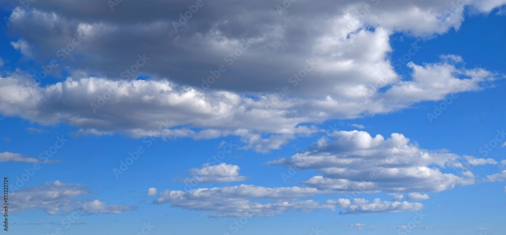 Beautiful blue sky with clouds background. Sky clouds. Air and fluffy clouds in the blue sky on a sunny day, background texture. Copy space. Beautiful blue sky with clouds background. Sky clouds. Air and fluffy clouds in the blue sky on a sunny day, background texture. Copy space.