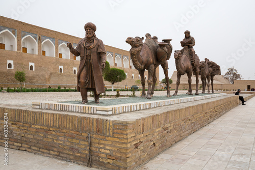 Sculpture group of an ancient caravan with camels photo