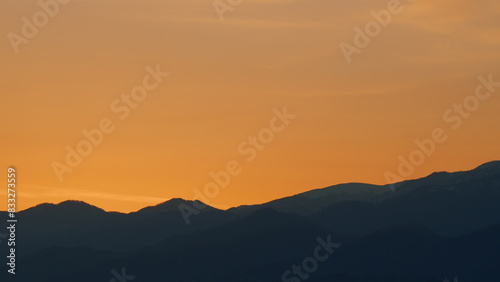 Sunrise Sky With Mountains. Natural Sunrise On Silhouette Shadow Dark Mountains. Real time.