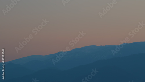 Sunrise Sky With Mountains. Natural Sunrise On Silhouette Shadow Dark Mountains. © artifex.orlova