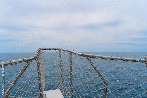 Yacht sailing on clean blue sea surface. Moving boat in the ocean. Side view sailing boat. Ocean sea water wave reflections. Motor boat in the sea. Speedboat in the clear turquoise sea