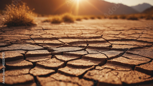 Barren land with dry, dead, cracked soil during long summer droughts. Global warming destroying life on the planet. Environmental ecological problems. Concept of natural disasters.