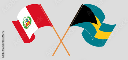 Crossed and waving flags of Peru and the Bahamas