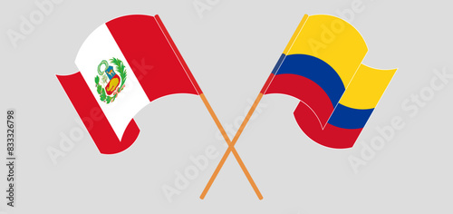 Crossed and waving flags of Peru and Colombia
