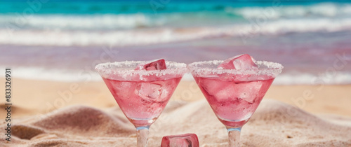 Pink cocktail on the tropical beach