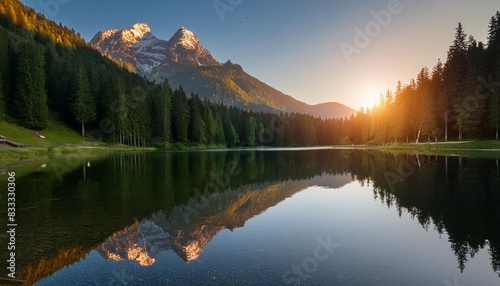 Sunset at a calm mountain lake in Austria with mirror-like reflection