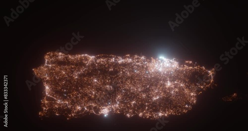 Puerto Rico island (Puerto Rico) aerial view at night. Top view on modern city with street lights. Camera is flying above the city, moving backward