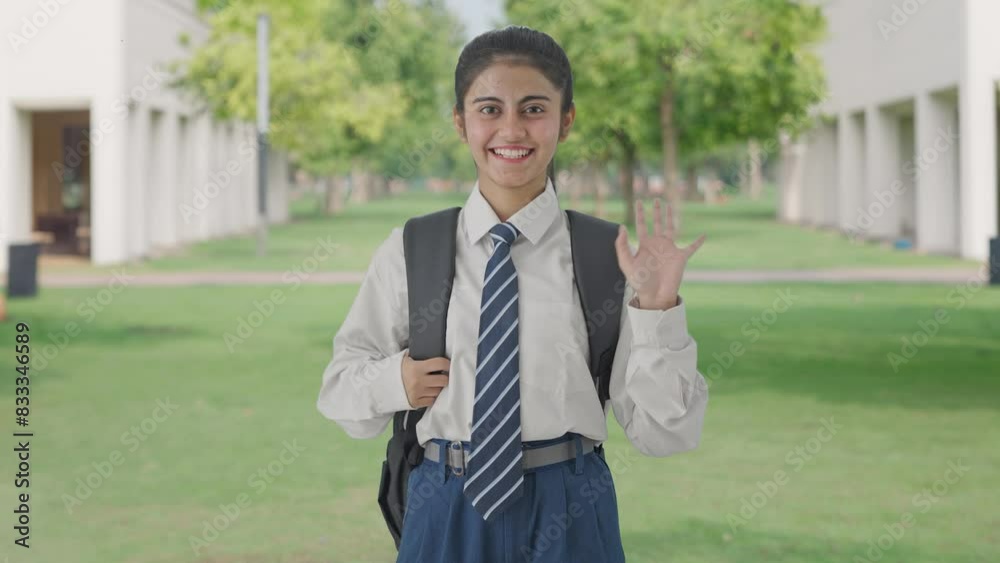 Happy Indian school girl saying Hello to the camera Happy Indian school girl saying Hello to the camera