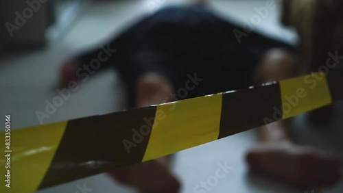 The corpse of a man in the apartment.
The crime scene is surrounded by police tape.
Police tape and grave markers from a police car.
Murder in the apartment