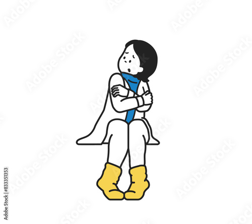 寒そうにしている女性