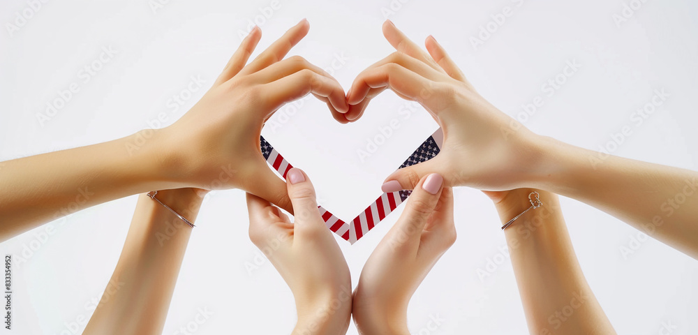 Woman's hands create heart shape around US flag. Woman's hands create heart shape around US flag.