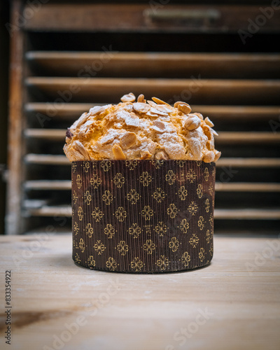 Gourmet panettone Topped with Caramelized Nuts on Wooden Bakery Counter