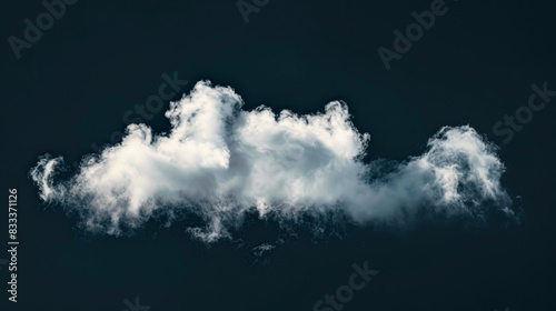 Single cloud isolated against a dark black background photo
