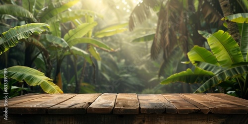 Wooden table in front of a lush green jungle with banana trees