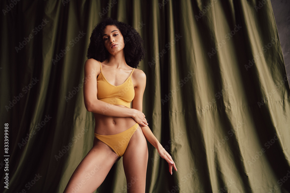 No retouch photo of gentle tender pretty girl wear trendy yellow activewear isolated on fabric khaki color background No retouch photo of gentle tender pretty girl wear trendy yellow activewear isolated on fabric khaki color background