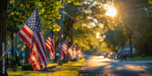American flags displayed on a sunny neighborhood street during sunset, creating a warm and patriotic atmosphere with vibrant colors and a sense of community pride
 photo