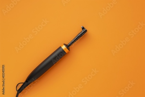 Modern Hair Curling Iron Isolated on Solid Background.