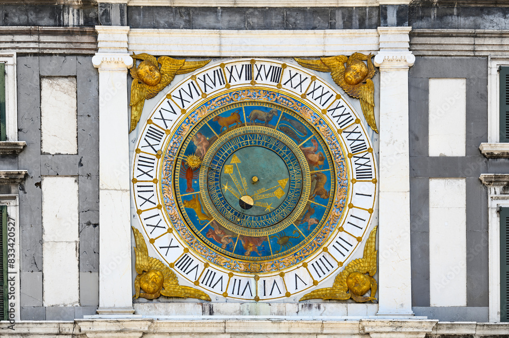 Fototapeta premium Vintage round zodiac, astrological calendar on the wall of an old building in the city of Brescia. Macro. Horizontal photo