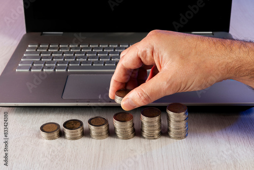 Hand of a man with coins savings concept