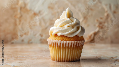 basic cupcake with white cream cap on beige background with texture, sweet business concept