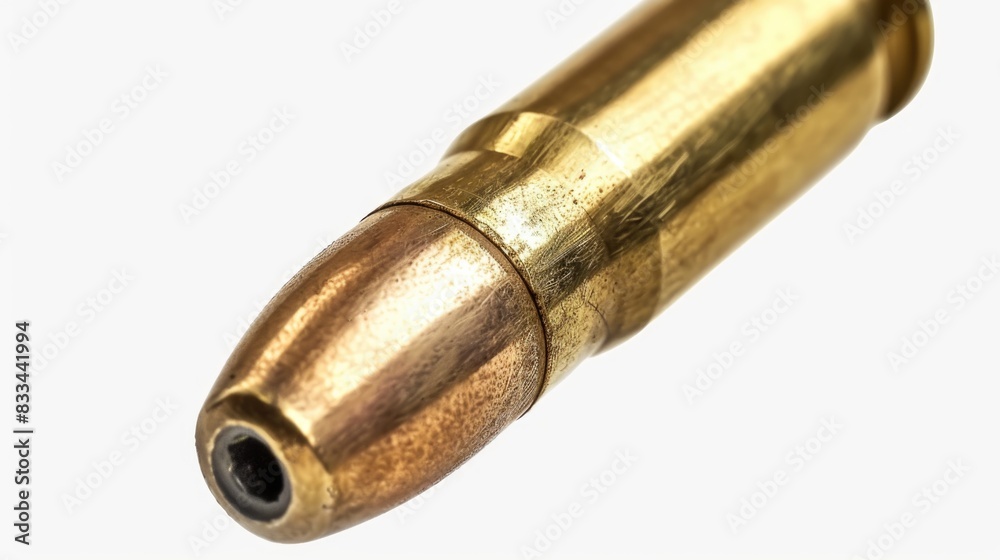 A close-up shot of a single bullet on a white background A close-up shot of a single bullet on a white background