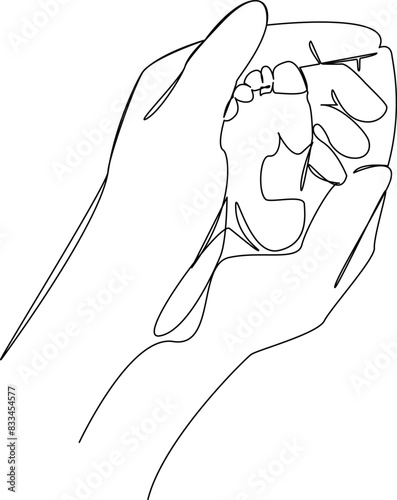 small foot in hands