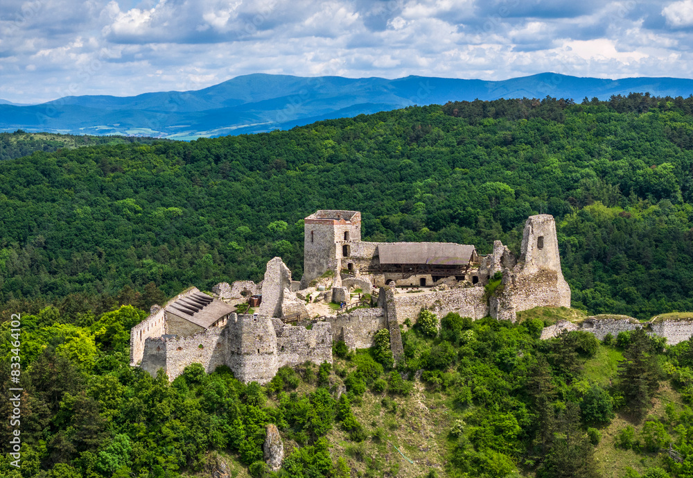 Aerial View of Cachtice Castle, in front of Little Carpathians, Slovakia Aerial View of Cachtice Castle, in front of Little Carpathians, Slovakia