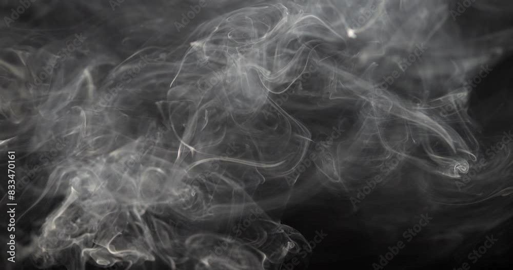 Smoke on a black background. Gray smoke in case of fire. Natural texture. Cigarette smoke.