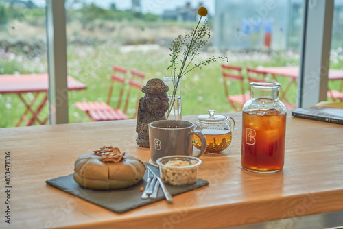 A bagel, tea and iced coffee