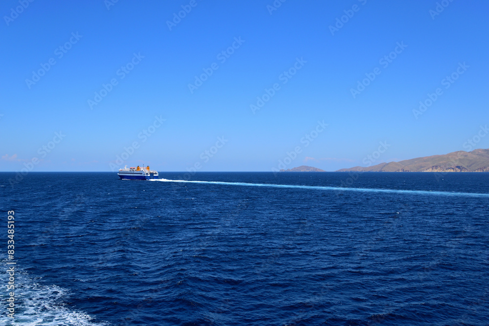 blue ferryboat crossing the blue sea - near Lemnos island, Greece, aegean sea blue ferryboat crossing the blue sea - near Lemnos island, Greece, aegean sea