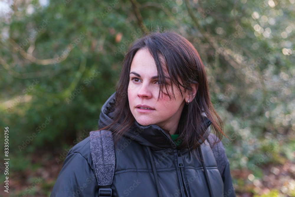 portrait of a young woman with backpack in the forest in autumn portrait of a young woman with backpack in the forest in autumn