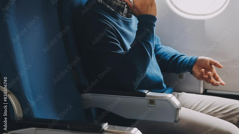 Side view portrait of handsome bearded businessman working while enjoying flight in first class, copy space Side view portrait of handsome bearded businessman working while enjoying flight in first class, copy space