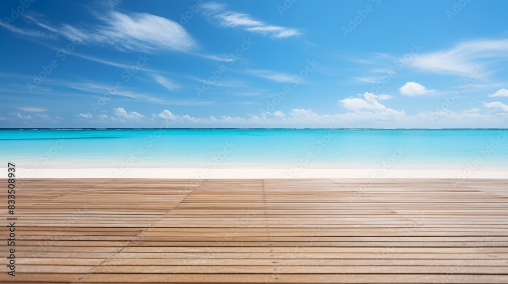 Fototapeta premium Tranquil beach scene with clear blue water and a wooden boardwalk