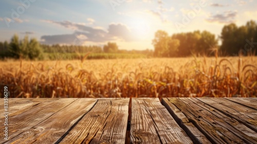 A Wooden table with blurred farm background on harvesting season.