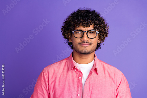 Photo of nice young man doubtful face wear pink shirt isolated on violet color background