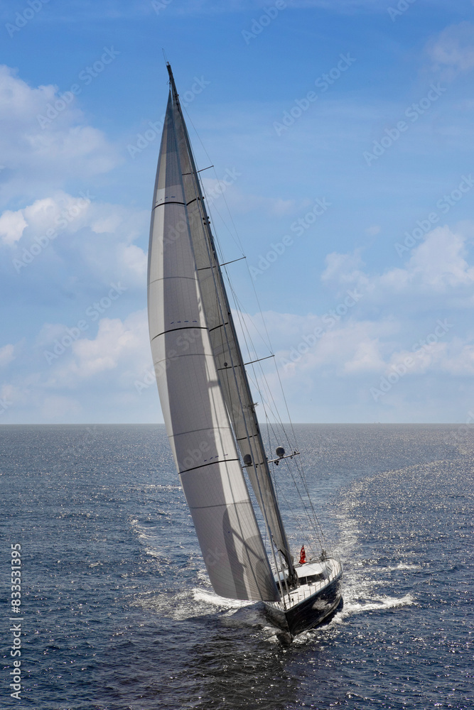 Sailing yacht at Mediterranean Sea. Sail. Boat. Helicopter view. Aerial. Palma de Mallorca. Super sailing yacht. Full sail.