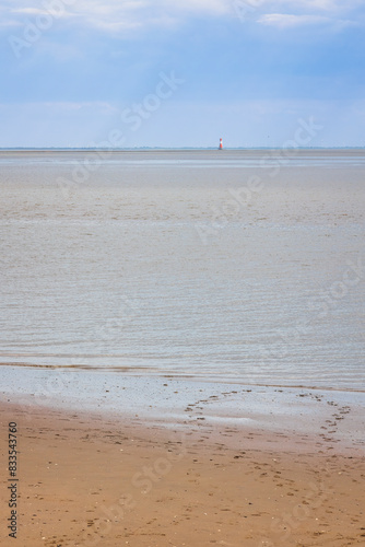 Blick vom Südstrand in Wilhelmshaven auf den Jadebusen und den Leuchtturm Arngast photo