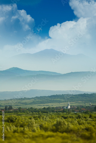 summer landscape with village and mountains